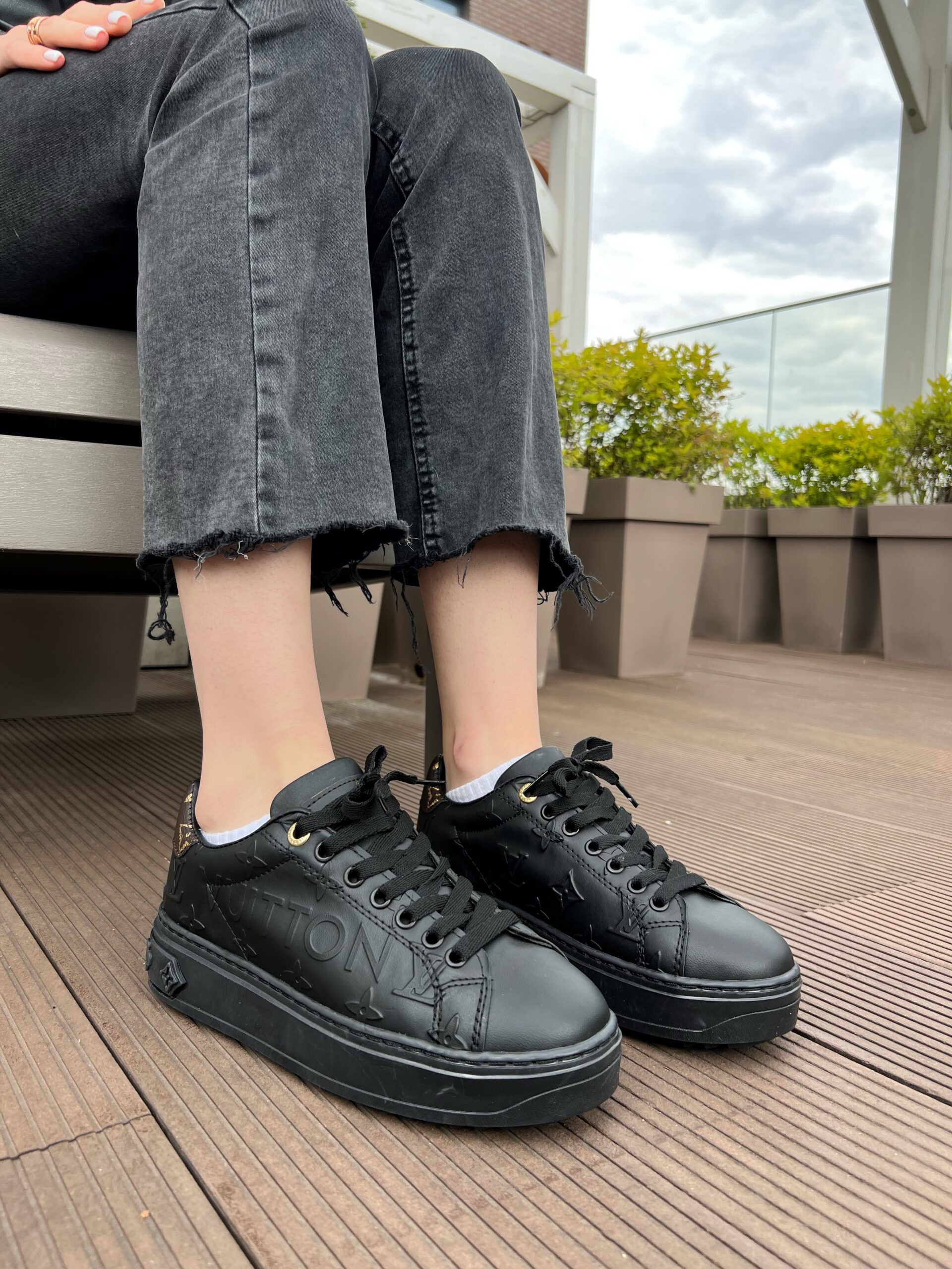 7b11e6eb-0ad4-4f3d-a483-454c59c7d752 LV time out black leather sneakers stylish for everyday wear - Image 1