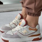 550 baltos/oranžinės zomšos / odos-stilius ir komfortas